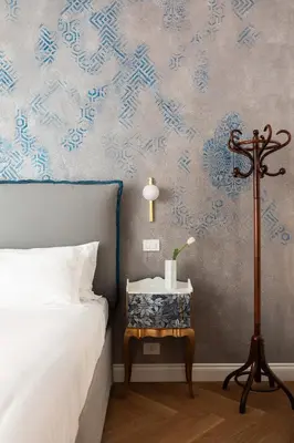 a bedroom with a bed and a side table with a lamp at Iflat New Spacious & Classy Apartment in Monti in Rome