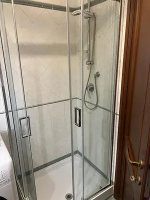 a shower with a glass door in a bathroom at Domus del Vicario in Rome