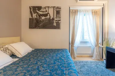 a bedroom with a bed and a window at NEW Luxury-On-Budget in Rome