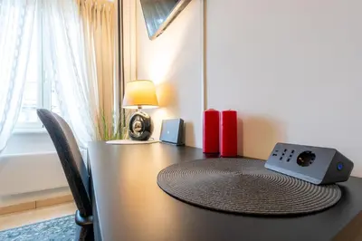 a table with a speaker sitting on top of it at NEW Luxury-On-Budget in Rome