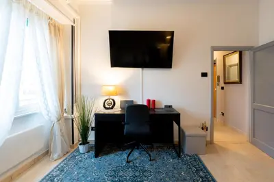an office with a desk and a chair in a room at NEW Luxury-On-Budget in Rome