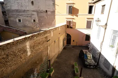 an empty alley way in an old building at Monti Elite House in Rome