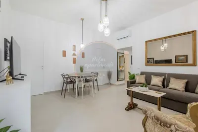 a living room with a couch and a table at Imperial Luxury in Rome