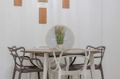 a table and chairs with a potted plant on it at Imperial Luxury in Rome