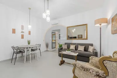a living room with a couch and a table at Imperial Luxury in Rome