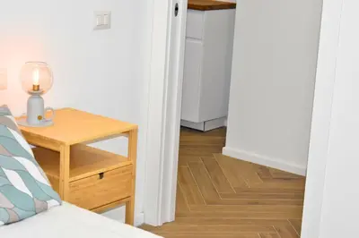 a bedroom with a bed and a table with a lamp at Dimora Artis by Gialel in Rome