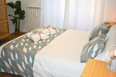a bed with two pillows on top of it at Dimora Artis by Gialel in Rome