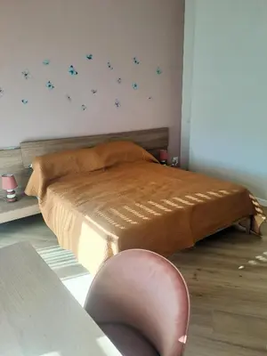 a bedroom with a bed with blue stars on the wall at Elegance Penthouse 959 in Rome