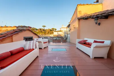 a living room with a couch and a table at Exentia Stays - Luxury Penthouse Spanish Steps in Rome