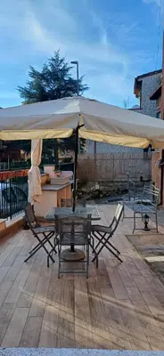 a table and chairs under a tent on a patio at CA' MATI Alloggio Turistico Vaticano in Rome