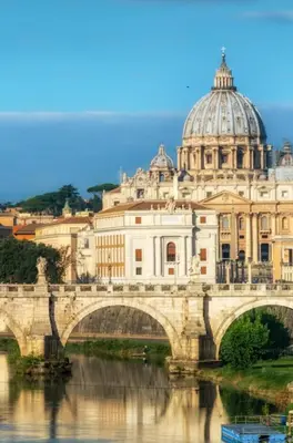 a bridge over a river with a building at CA' MATI Alloggio Turistico Vaticano in Rome