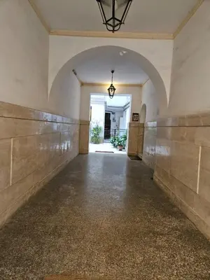 an empty hallway with an archway in a building at Raggio di Sole in Rome