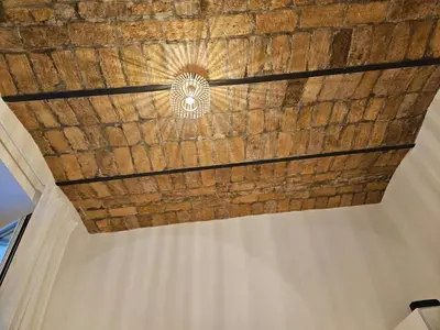 a ceiling of a room with a wooden ceiling at Raggio di Sole in Rome