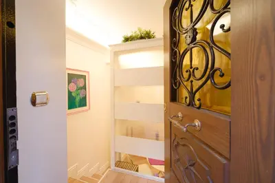 a door leading into a hallway with a mirror at Ad un passo da San Pietro in Rome