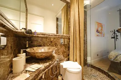 a bathroom with a bowl sink and a toilet at Ad un passo da San Pietro in Rome