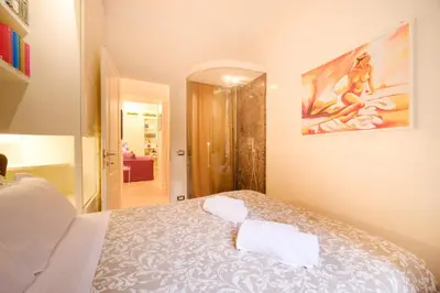 a bedroom with a bed and a bathroom at Ad un passo da San Pietro in Rome