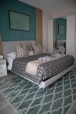 a bedroom with a large bed in a room at Sara's Home - Modern Apartment Near Metro, Perfect for Families and Groups in Rome in Rome