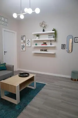 a living room with a coffee table and a couch at Sara's Home - Modern Apartment Near Metro, Perfect for Families and Groups in Rome in Rome