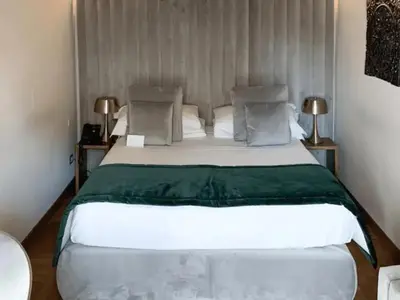 a bedroom with a large white bed in a room at pantheon suite 11 in Rome
