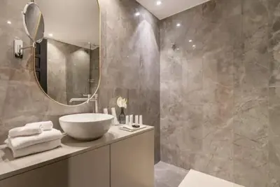 a bathroom with a bowl sink and a mirror at pantheon suite 11 in Rome
