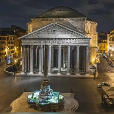 a large building in a city at night at pantheon suite 11 in Rome