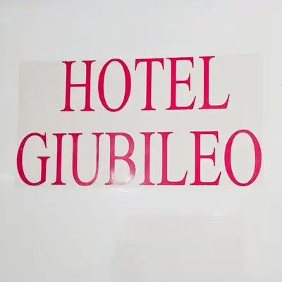 a red sign with the words hotel guelico at Hotel Giubileo in Rome