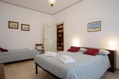a bedroom with a bed with towels on it at Casa NeLLa, Apartment with 2 bedrooms, Rome in Rome