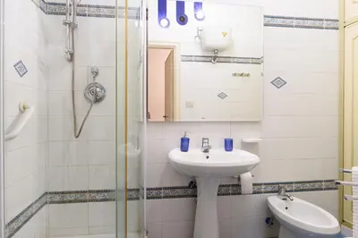 a bathroom with a sink and a shower at Casa NeLLa, Apartment with 2 bedrooms, Rome in Rome
