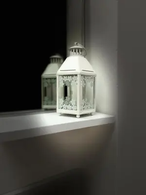 two lanterns sitting on a shelf in a room at San Giovanni Studio in Rome
