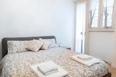 a bedroom with a bed with towels on it at Sidama Boutique Stay in Rome