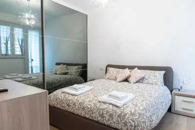 a bedroom with a bed with two towels on it at Sidama Boutique Stay in Rome