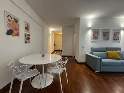 a living room with a table and a couch at Papa's Apartment - A new flat in Portuense in Rome