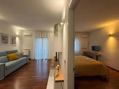 a living room with a bed and a couch at Papa's Apartment - A new flat in Portuense in Rome