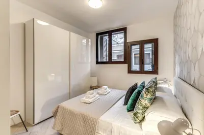 a bathroom with a white tub and a sink at The Loft Trastevere in Rome