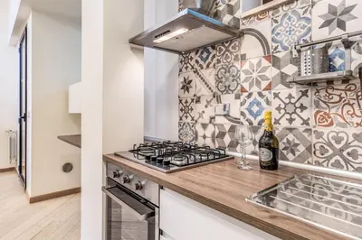 a bathroom with a washer and a washing machine at The Loft Trastevere in Rome