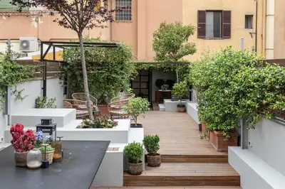 a courtyard with potted plants on a building at Terrazza segreta del Vaticano in Rome
