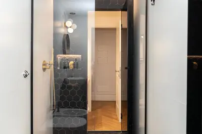 a bathroom with a glass door with a toilet in it at Terrazza segreta del Vaticano in Rome
