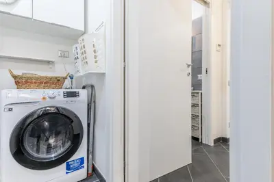 a laundry room with a washer and dryer at Battistini Sweet House in Rome