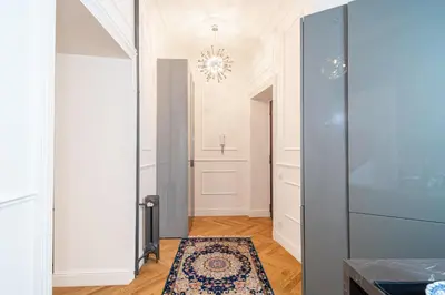 a hallway with a glass door and a rug at Vatican Boutique RHome in Rome