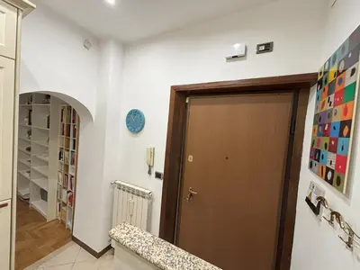 a hallway with a brown door in a room at Ai Quattro Cantoni in Rome