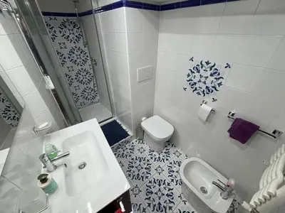 a small bathroom with a sink and a toilet at Ai Quattro Cantoni in Rome