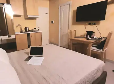 a room with a bed with a laptop on it at Trinità Dei Monti in Rome