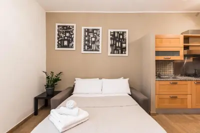 a bedroom with a bed with two towels on it at Trinità Dei Monti in Rome