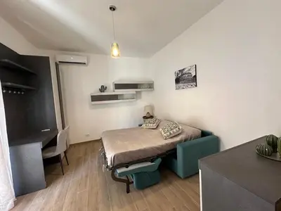 a small room with a bed and a desk at Pineta Domus in Rome