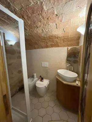 a bathroom with a sink and a toilet at Roman times experience in Monti area in Rome