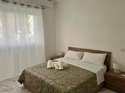 a bedroom with a bed with two towels on it at Casa Justa Gregorio VII in Rome