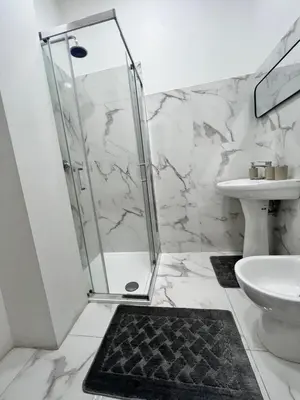 a bathroom with a shower and a sink at Casa Justa Gregorio VII in Rome