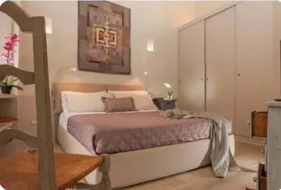 a bedroom with a large bed in a room at Sophisticated apt near Navona square in Rome