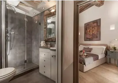 a bathroom with a bed and a shower and a toilet at Sophisticated apt near Navona square in Rome