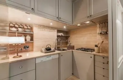 a large kitchen with white cabinets and a stove at Sophisticated apt near Navona square in Rome